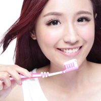 Close up of Smile woman brush teeth. great for health dental care concept, Isolated over white background. asian